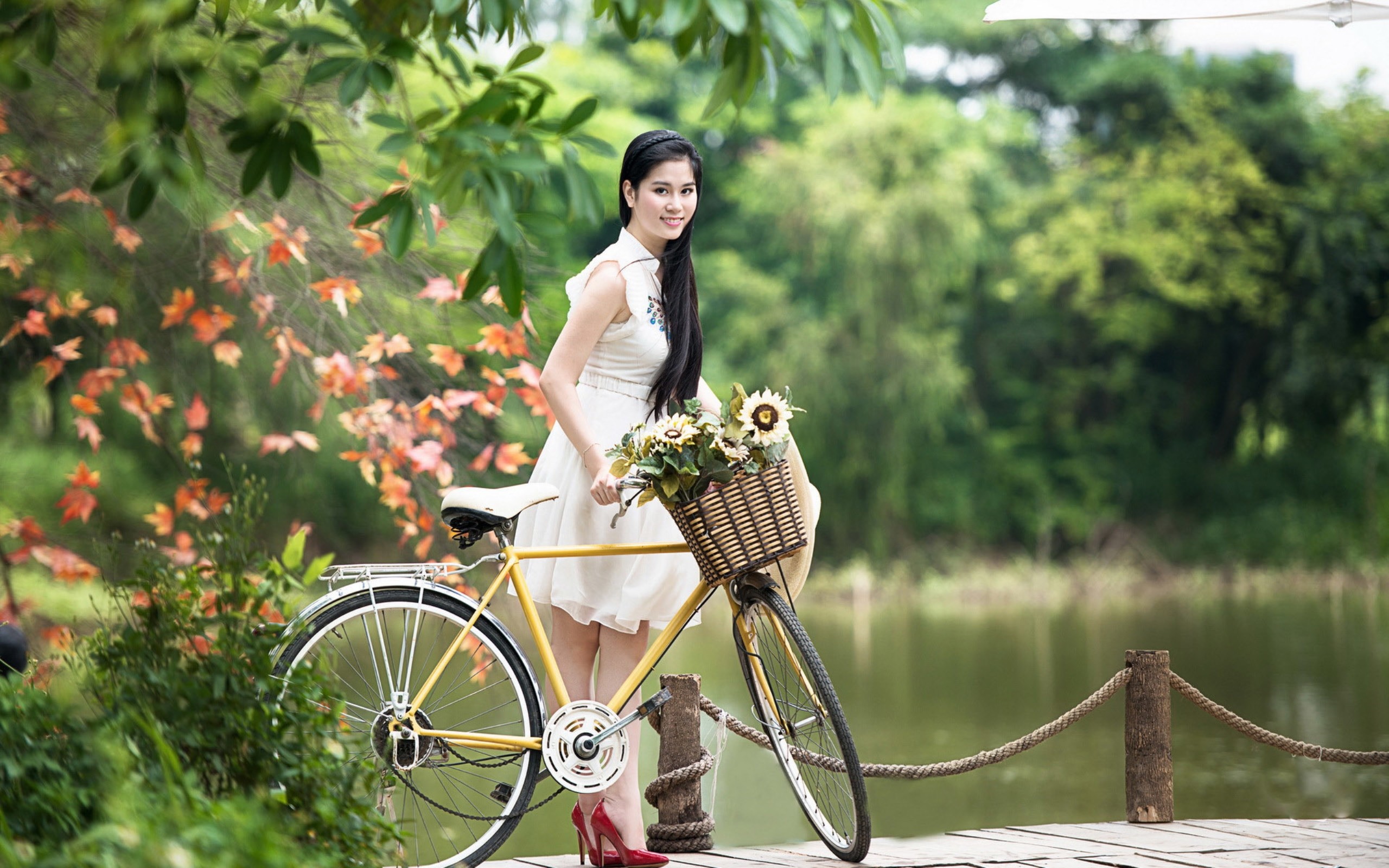 Nude asian model on a bicycle