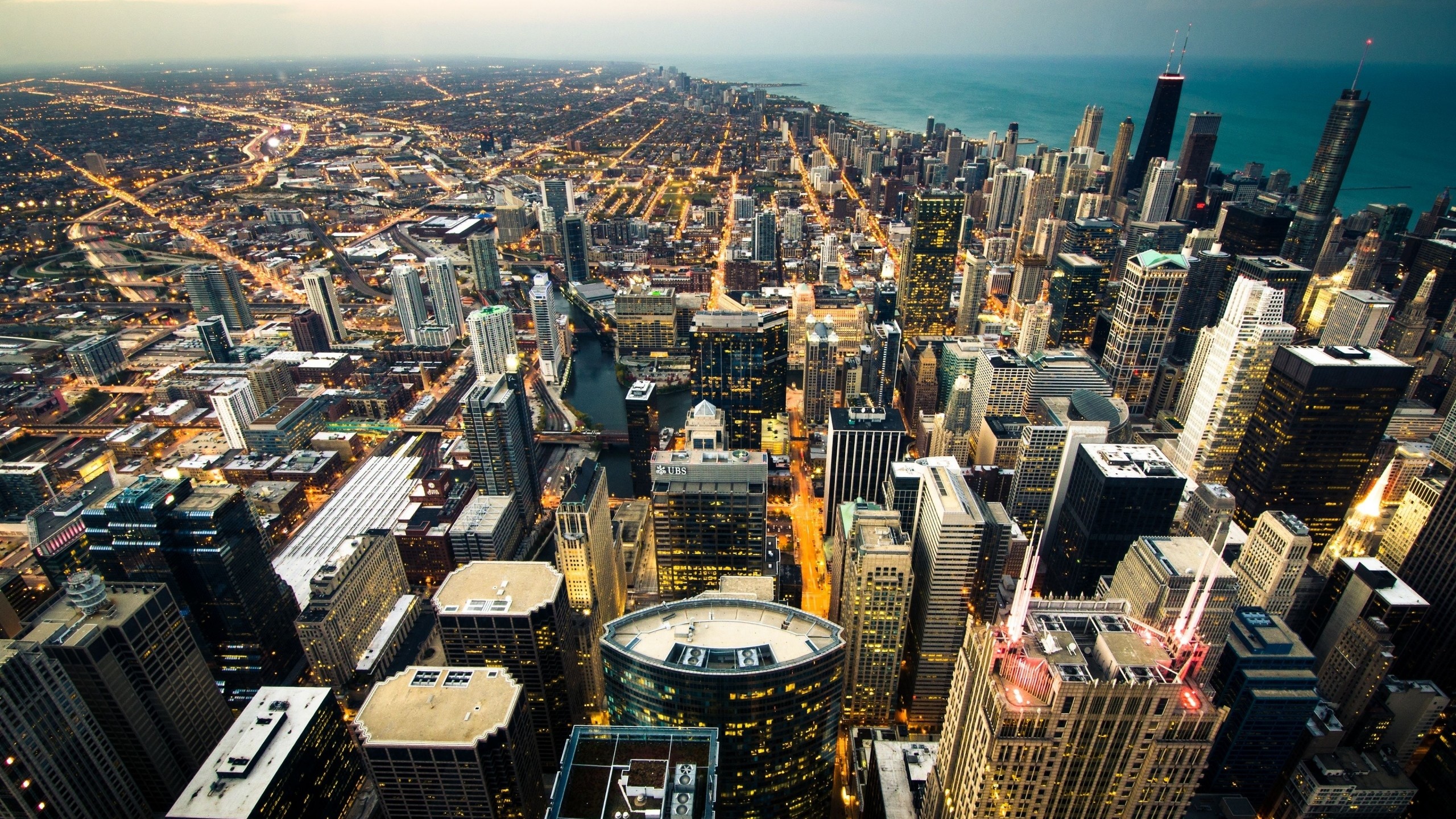 Preview wallpaper chicago, skyline, city lights, coastline 2560×1440
