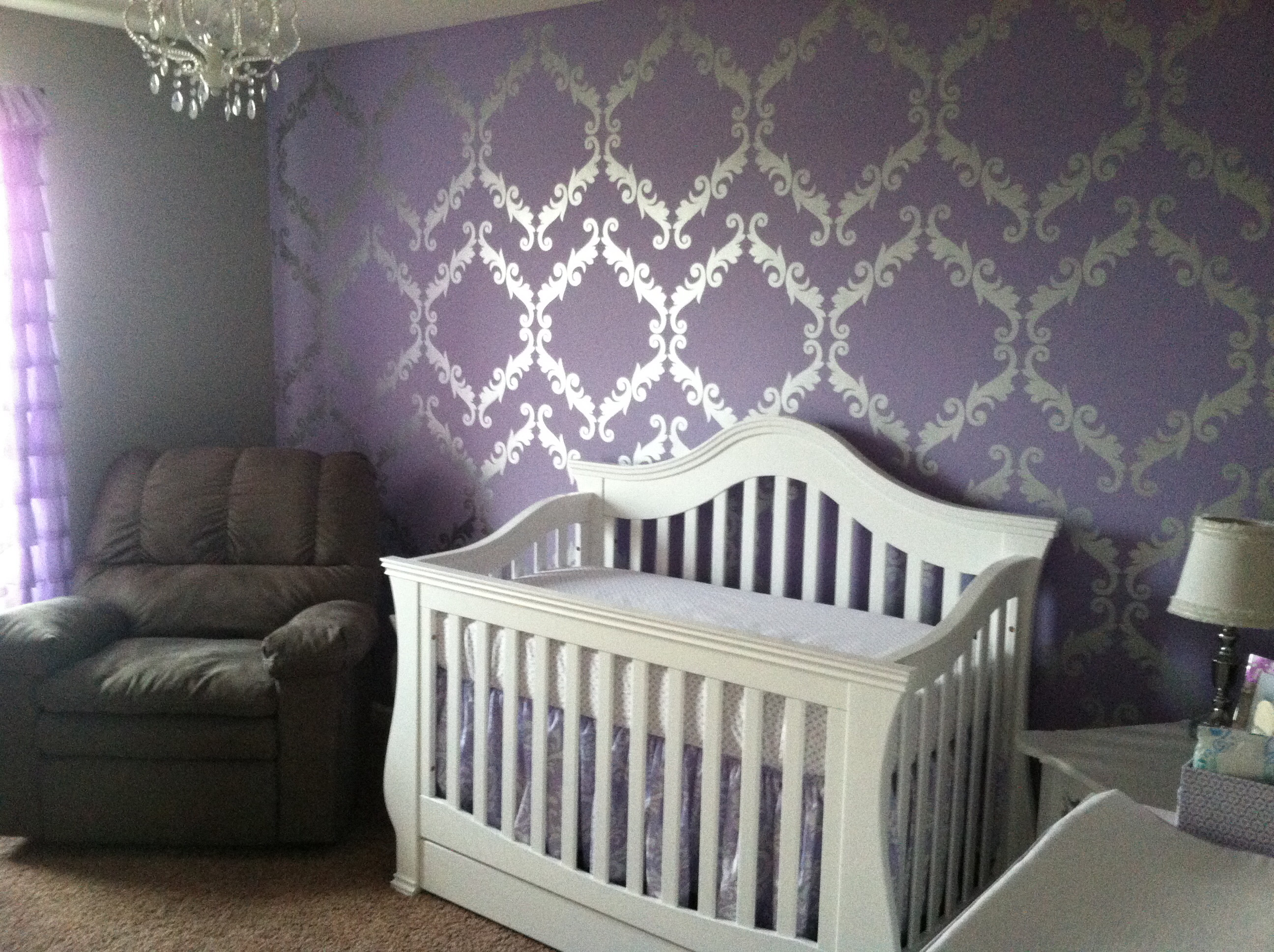 Purple, metallic silver and white baby girl's nursery