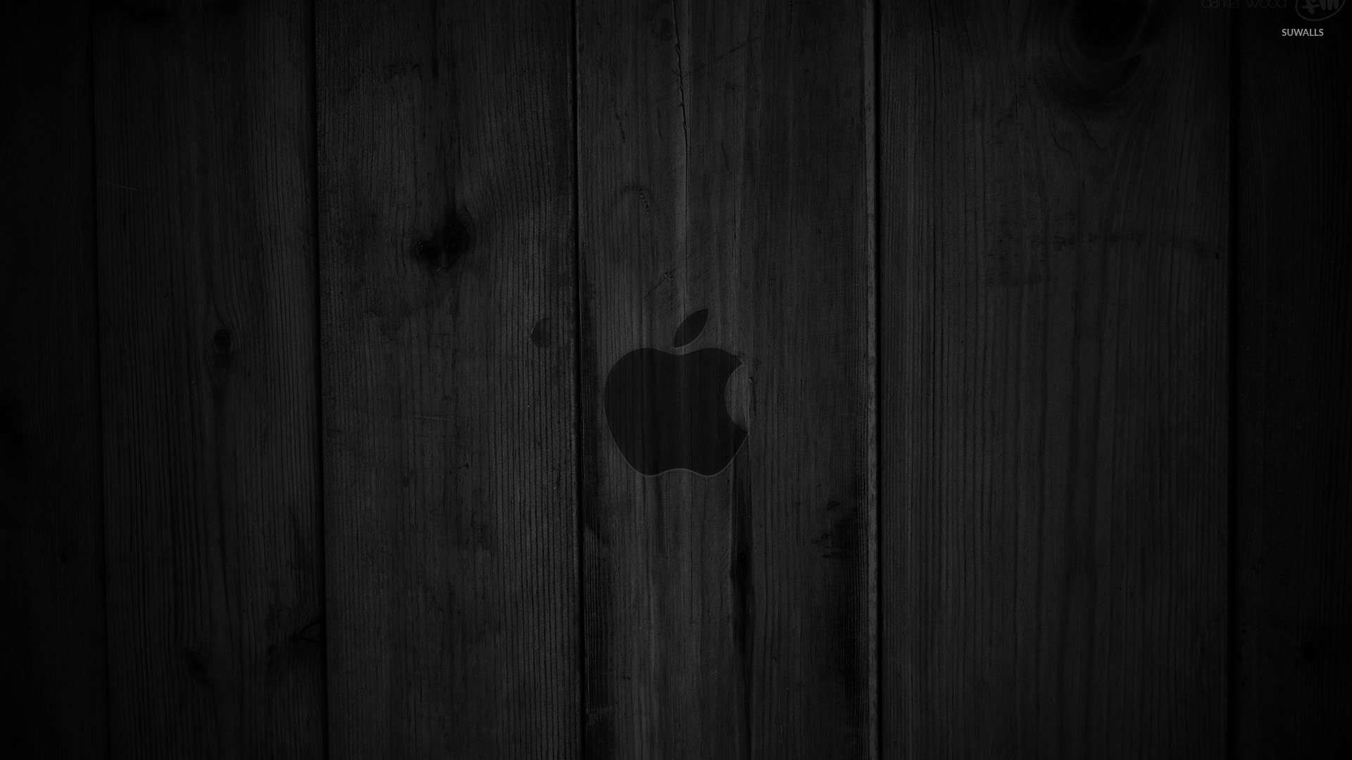 Dark gray Apple on the wooden panels wallpaper