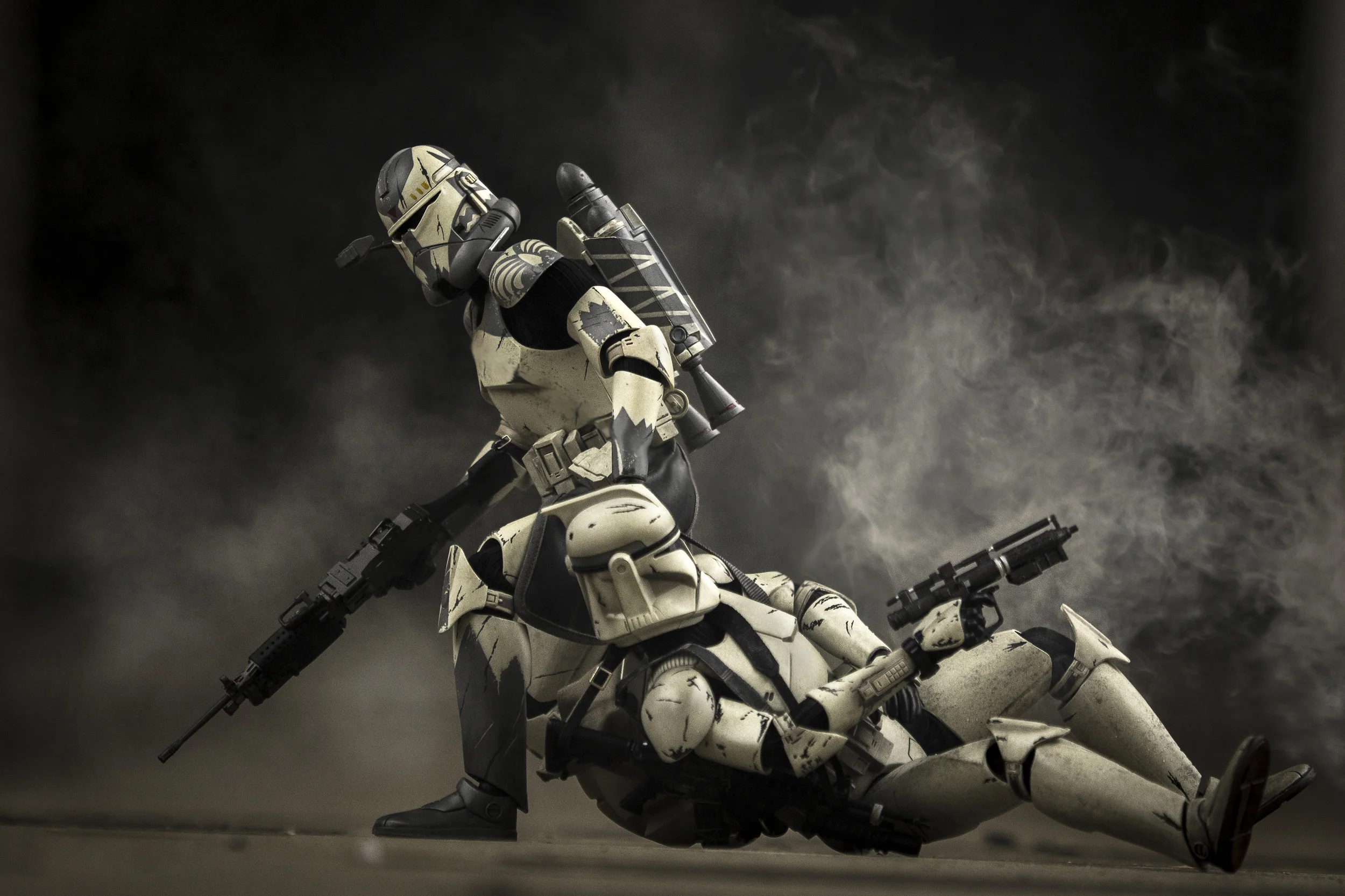 Clone Commander drags a wounded clone out of a kill zone after being