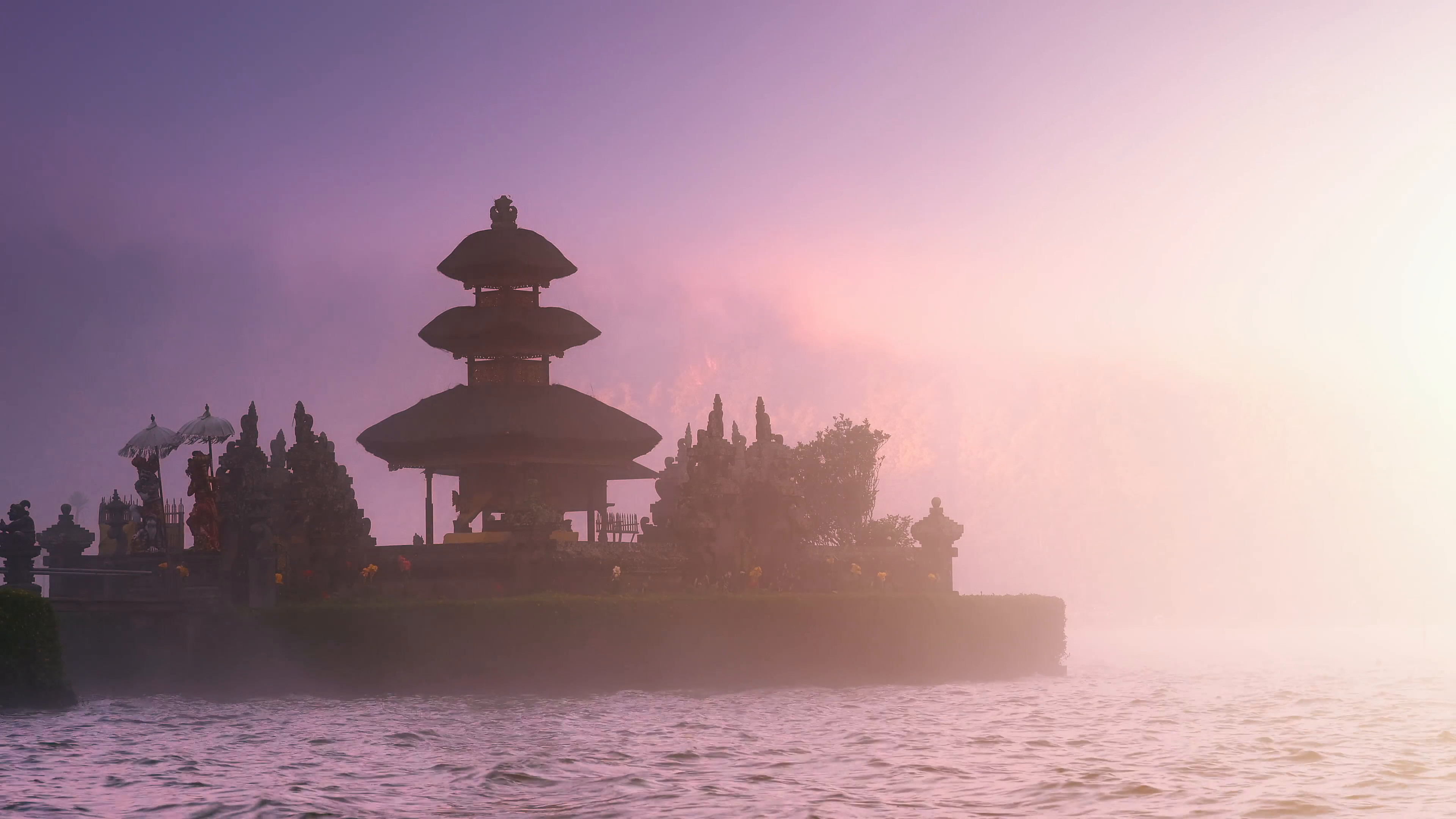 Scenic background of beautiful Bali temple in mist on lake under sunset sunlight Stock Video Footage – VideoBlocks