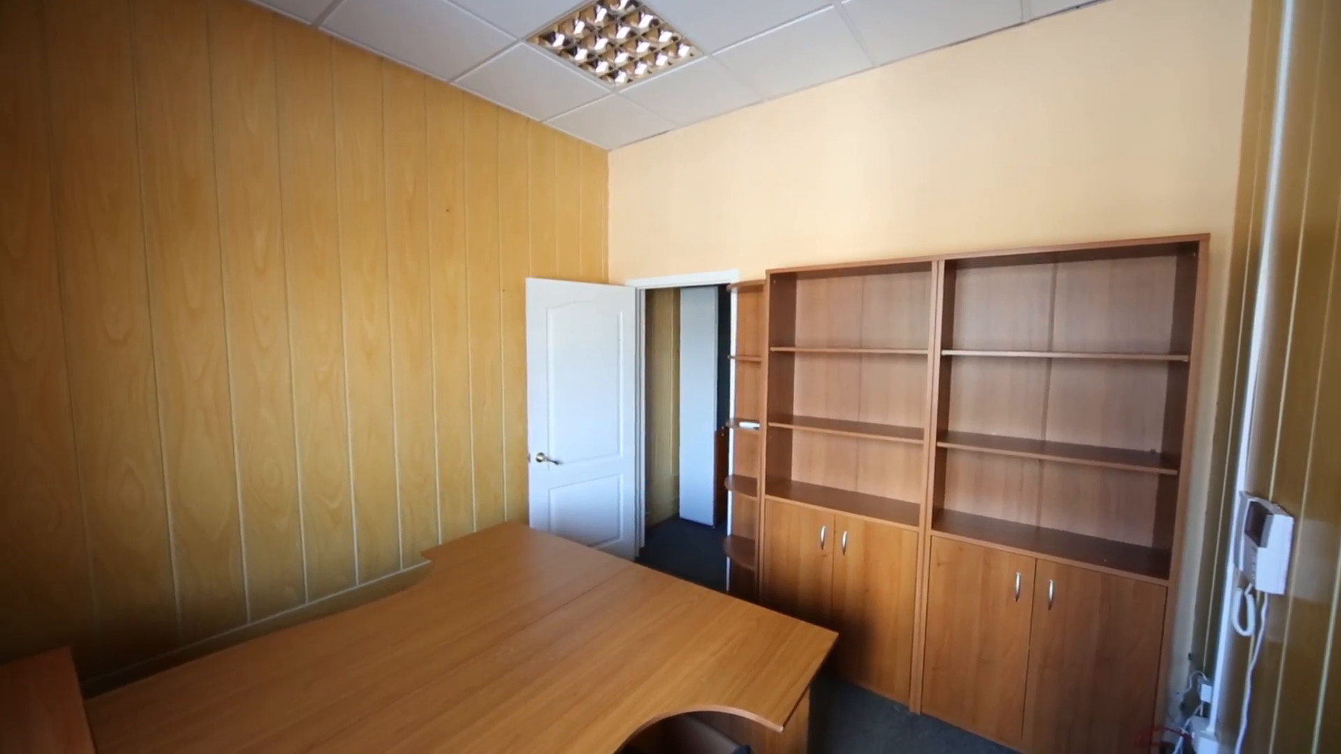 A small office room with a work desk and empty cabinets Stock Video Footage  – VideoBlocks