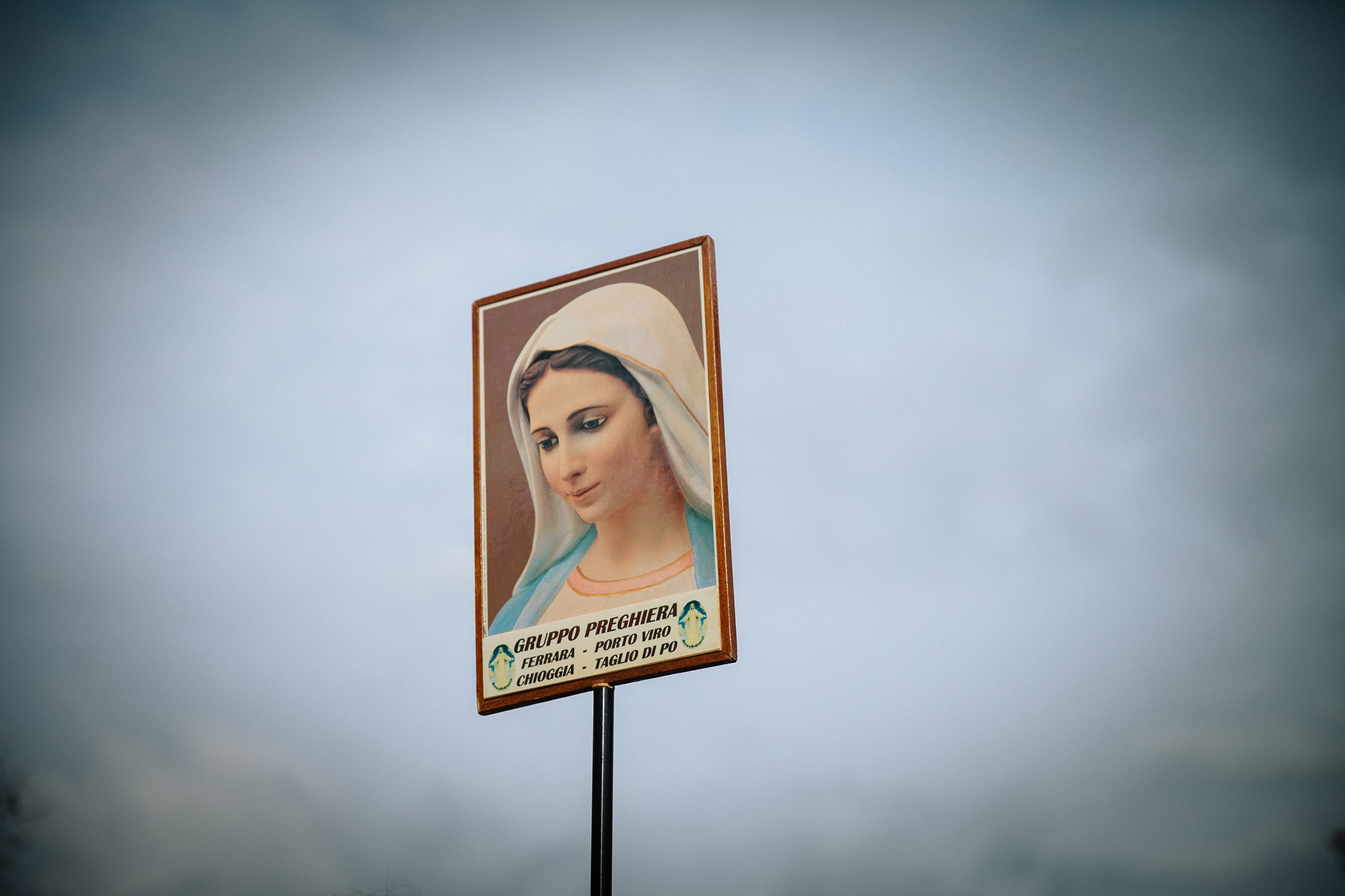 Picture of a sign showing an image of the Virgin Mary