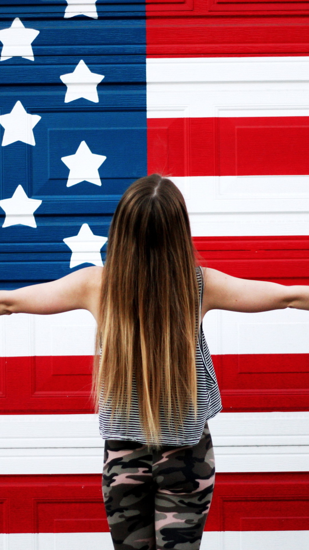American girl in front of usa flags. america wallpaper