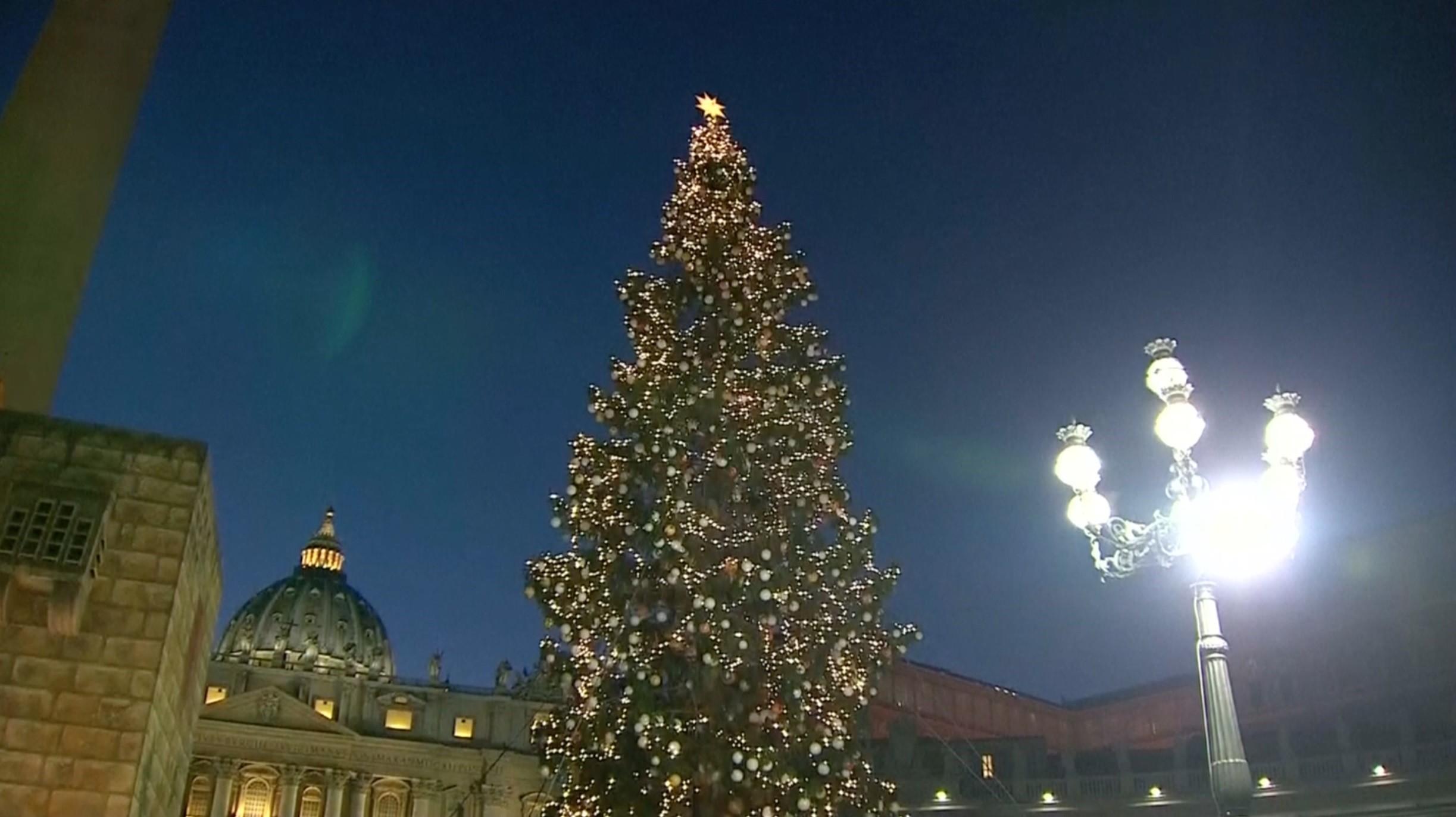 Vatican Christmas tree is lit in St. Peters Square, adorned with ornaments made from sick children across Italy and the nativity scene includes a spire