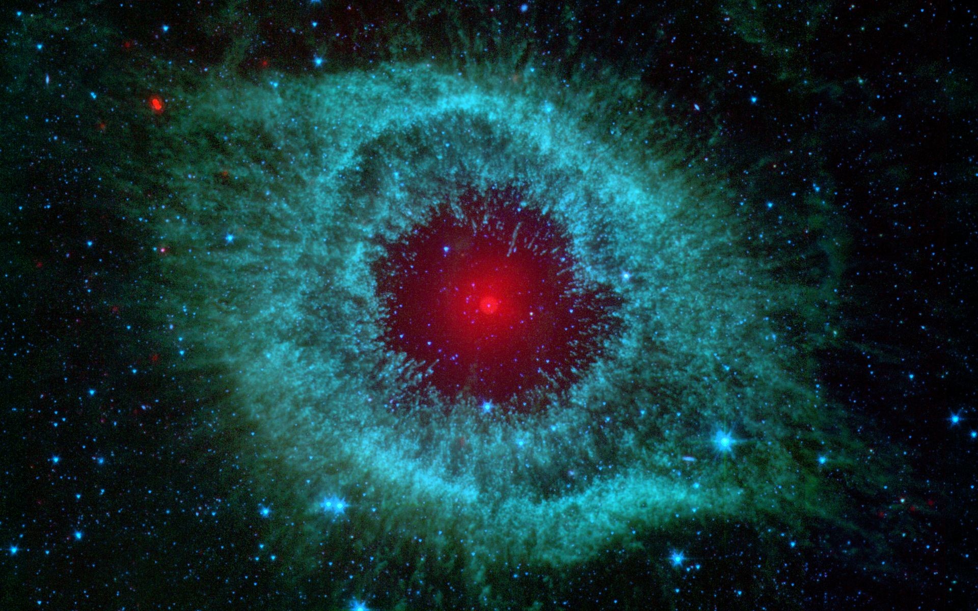 This infrared image from NASAs Spitzer Space Telescope shows the Helix nebula, a cosmic starlet