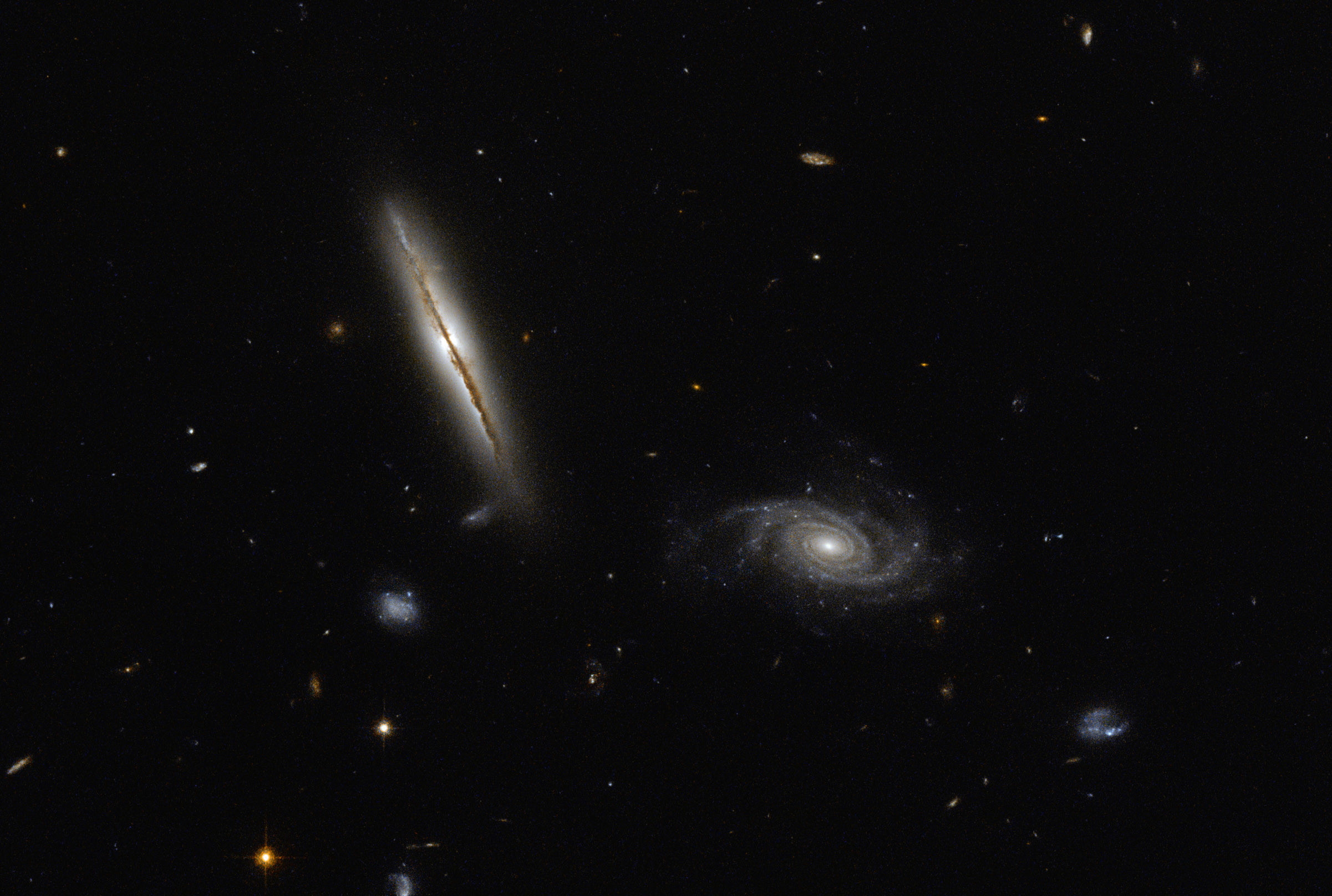 Hubble Space Telescope image of spiral galaxies LO95 0313-192 (left) and [