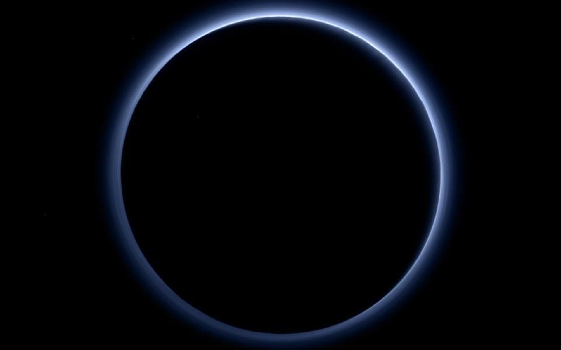 Pluto's haze layer shows its blue color in this picture taken by NASA's New  Horizons.