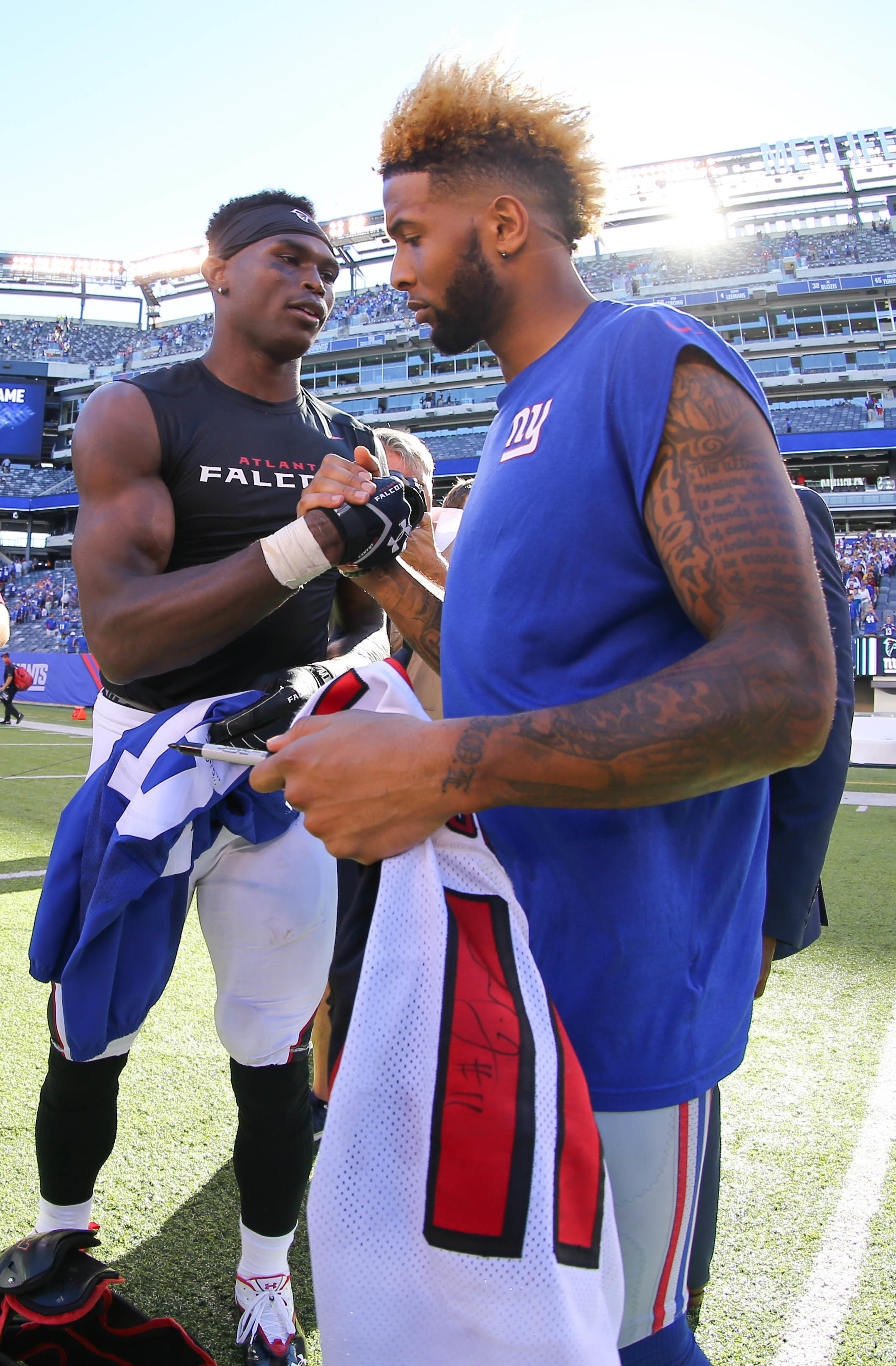 Atlanta Falcons wide receiver Julio Jones and New York Giants wide receiver Odell Beckham Jr. exchange jerseys after their game at MetLife Stadium